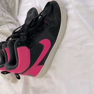 Size 6 black and pink pair of Nikes worn but in good condition